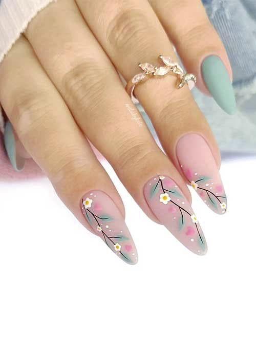 Ongles avec motifs floraux sur base nude mat